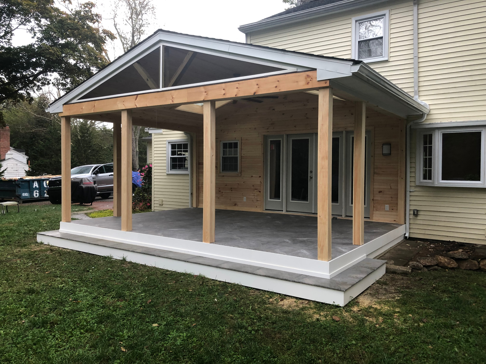 Covered patio structure with natural timber framing